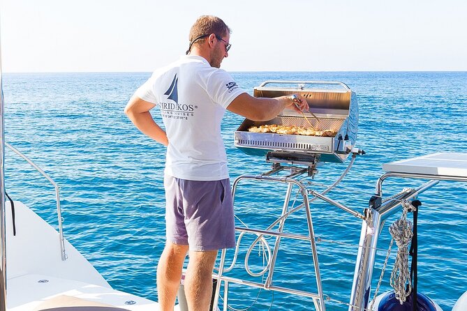 Premium Small-Group Catamaran Cruise with BBQ, Open Bar, Transfer - Thirasia and the caldera from sea level