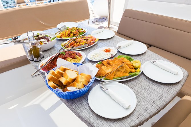 Premium Small-Group Catamaran Cruise with BBQ, Open Bar, Transfer - Pickup, marina details, and timing