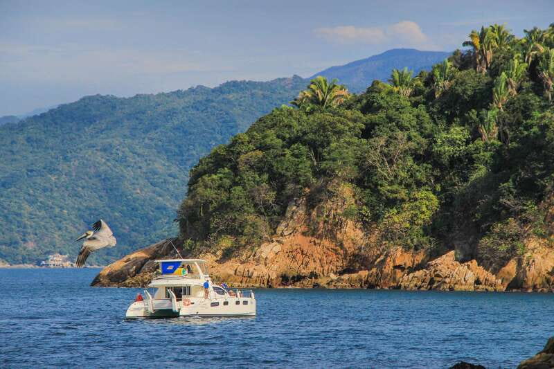 Puerto Vallarta: Luxury Yacht Tour with Lunch and Open Bar - Leaving Puerto Vallarta through the Bay of Banderas
