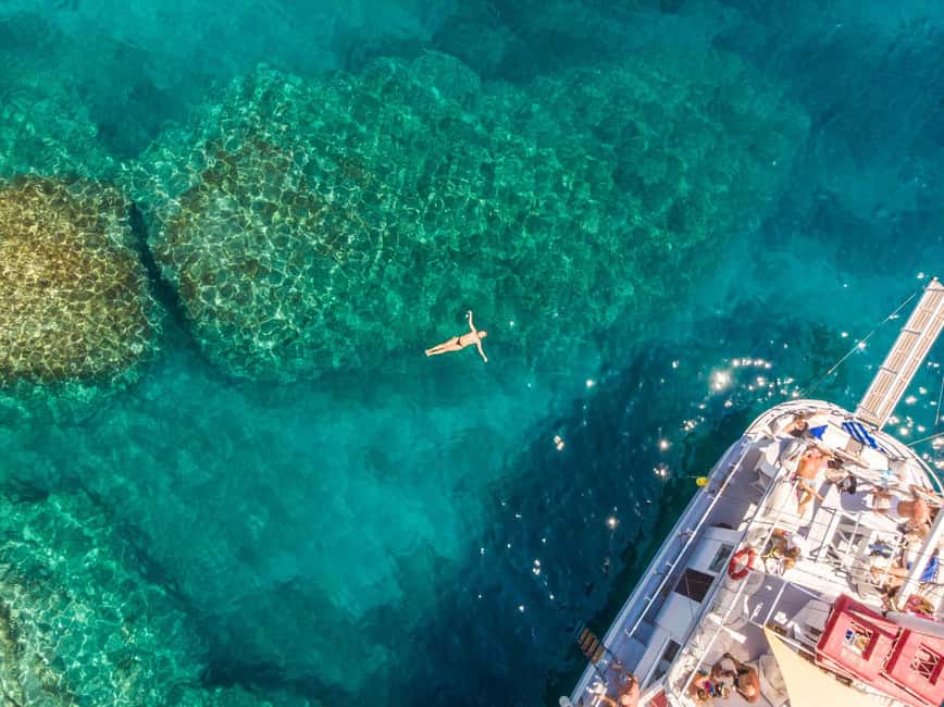 Rhodes: Boat Tour with Snorkeling, Gourmet Buffet & Open Bar - Boarding the Romantika at Mandraki Port