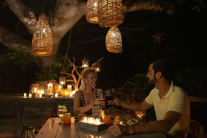 Rhythms of the night, Sunset Cruise, Candlelit Dinner & Alma Show - Arriving at torchlit Las Caletas