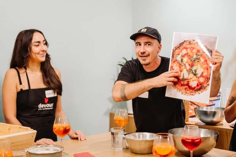 Rome: Pizza Making Class with Gelato & Drinks Included - Sitting down with wine, beer, and new companions
