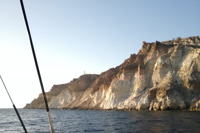 Santorini Catamaran Cruise with Fresh Meal and Open Bar - White Beach and Santorini’s southern cliffs