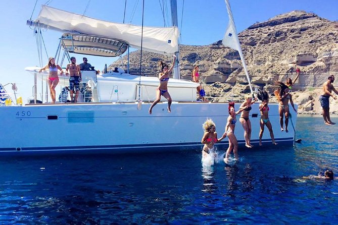 Santorini Catamaran Cruise with Fresh Meal and Open Bar - Palea Kameni and the sulfur-tinted hot springs