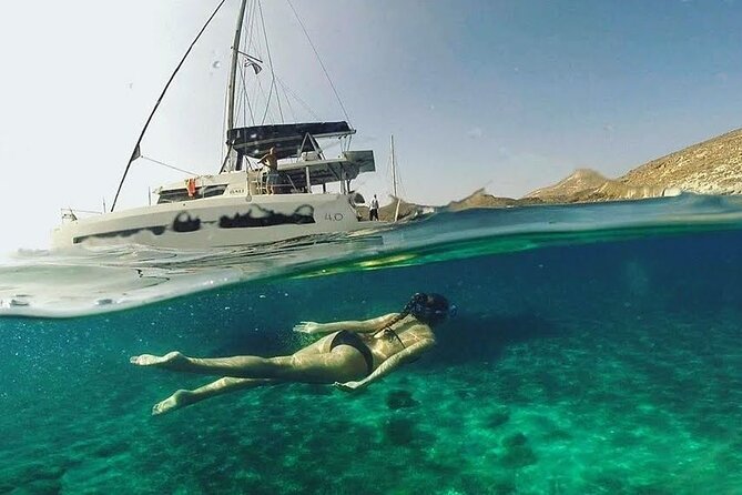 Santorini Catamaran Cruise with Fresh Meal and Open Bar - Wine, beer, music, and the mood onboard