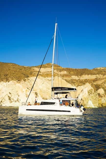 Santorini: Catamaran Cruise with Fresh Meal & Open Bar - Red Beach, sunset, and the ride back