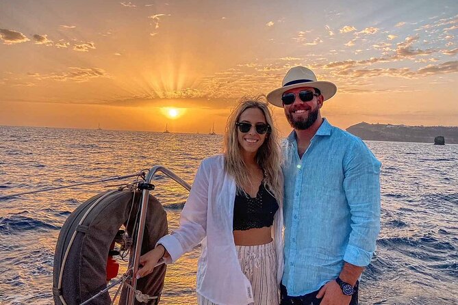 Santorini Catamaran Cruise with Greek Meal, Open-Bar and Sunset - Oia from below, only on luxury options