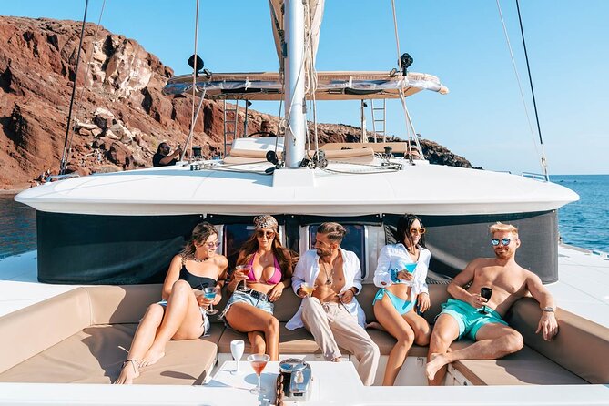 Santorini Catamaran Cruise: with Lunch, BBQ, Open Bar, Transfers - White Beach, Indian Rocks, and the Venetian Lighthouse