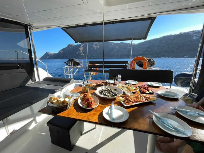 Santorini: Catamaran Cruise with Meal & Open Bar - The lighthouse and the volcanic caldera