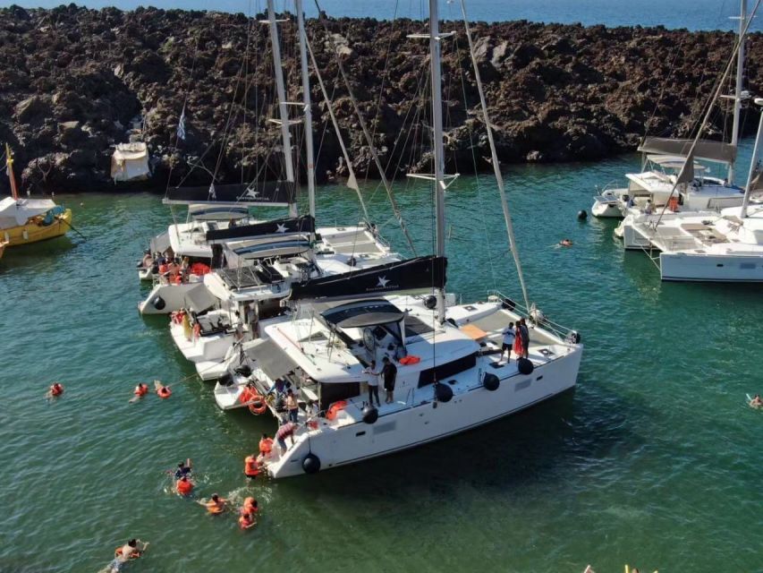 Santorini: Catamaran Cruise with Meal & Open Bar - Swimming at the Santorini hot springs