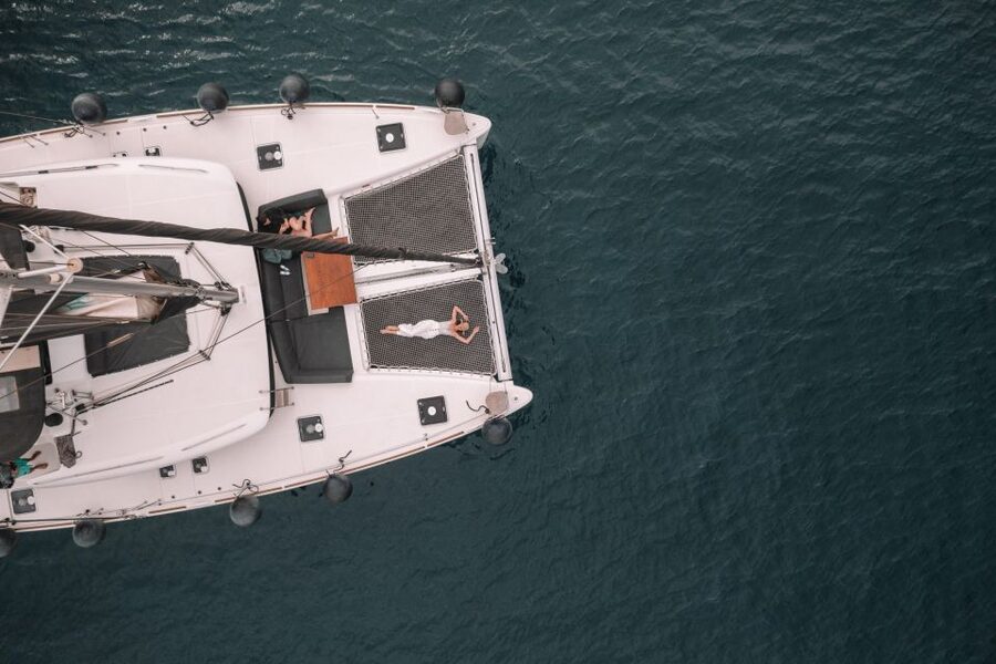 Santorini Catamaran Cruise with Swimming, Meal and Open Bar - Red Beach, White Beach, and the volcanic coast