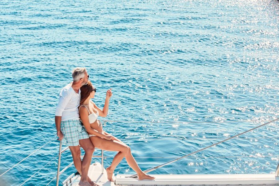 Santorini: Catamaran Tour with BBQ Meal and Unlimited Drinks - Sailing past Santorini’s southern landmarks
