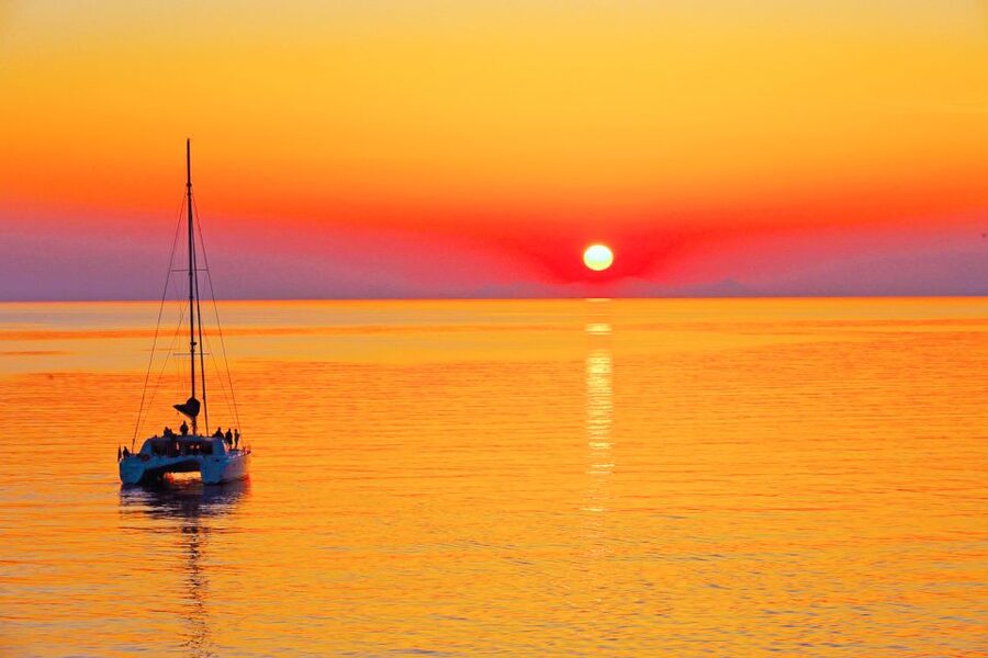 Santorini: Catamaran Tour with BBQ Meal and Unlimited Drinks - Who should book this Santorini cruise?