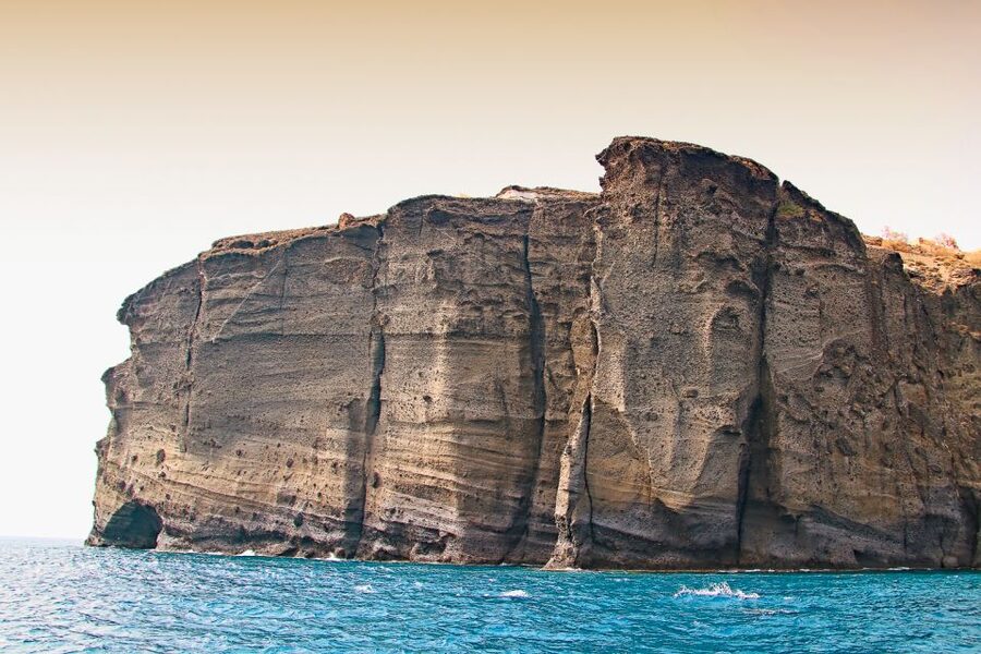 Santorini: Day Cruise with Meal & Open Bar - White Beach, Black Mountain, and the southern lighthouse