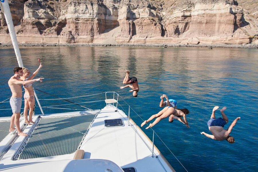 Santorini Gold Catamaran Cruise with Snorkel, BBQ & Open Bar - Leaving Vlychada Marina on a comfortable catamaran