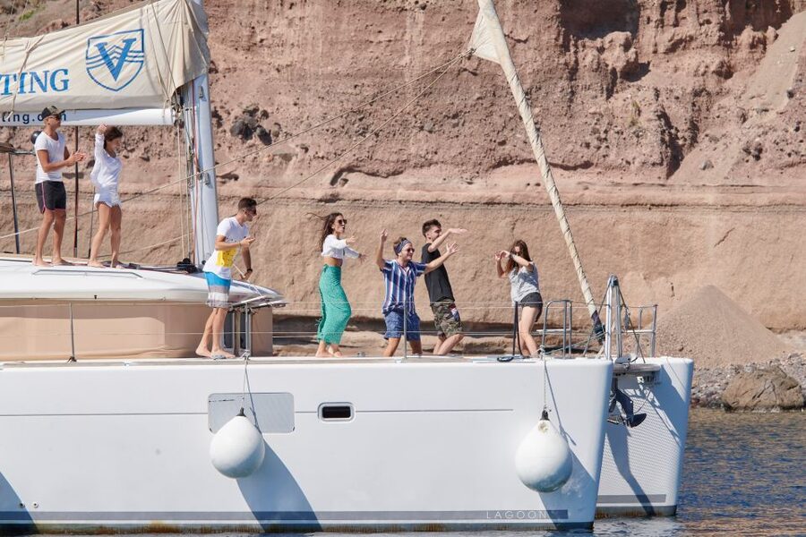Santorini Gold Catamaran Cruise with Snorkel, BBQ & Open Bar - White Beach and the Venetian lighthouse are better from offshore