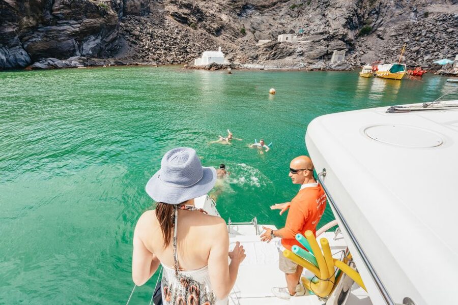 Santorini: Luxury Catamaran Day Trip with Meal and Open Bar - White Beach sea caves and volcanic water