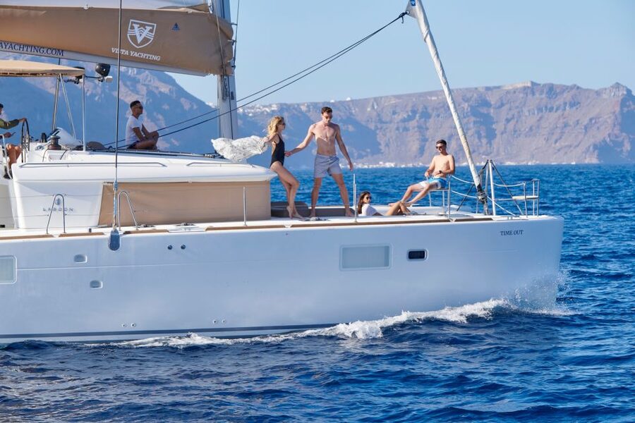 Santorini: Platinum Catamaran Cruise w/ BBQ Meal & Open Bar - The sunset near Akrotiri Lighthouse