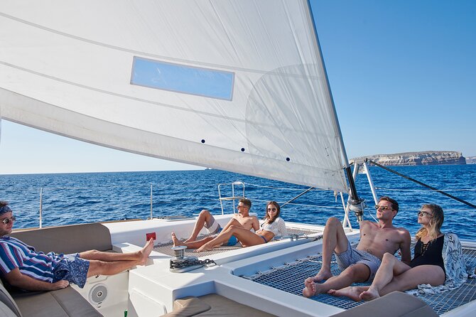 Santorini Platinum Catamaran Cruise with Meal, BBQ and Open Bar - The Akrotiri Lighthouse and Volcanic Coast