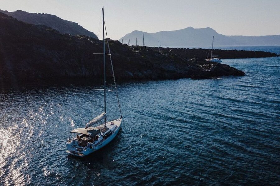 Santorini: Private Caldera Sailing Trip with Open Bar & Meal - Swimming near Black Mountain