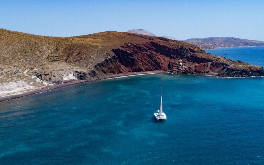 Santorini: Private Day Cruise with a BBQ meal and Open Bar - Swimming, snorkeling, and the open Aegean