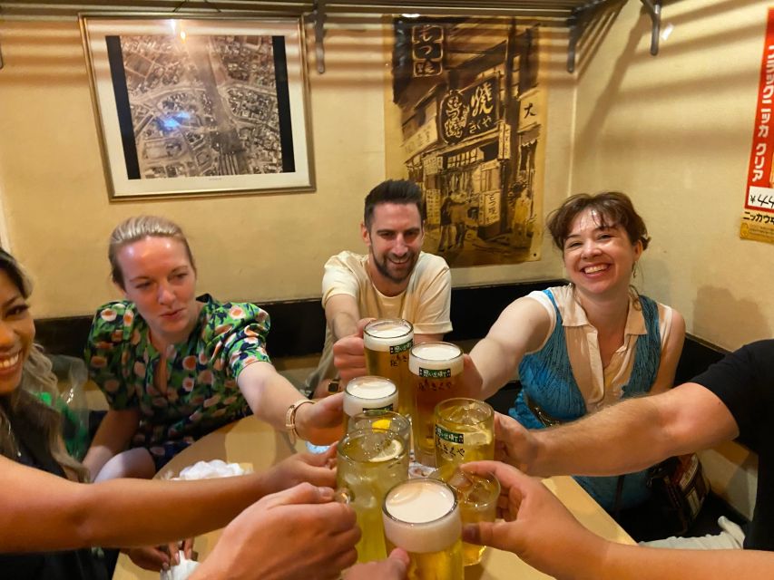 Shinjuku: bar hopping night tour at Japanese Izakaya - Kabukicho after dark: signs, crowds, and local caution