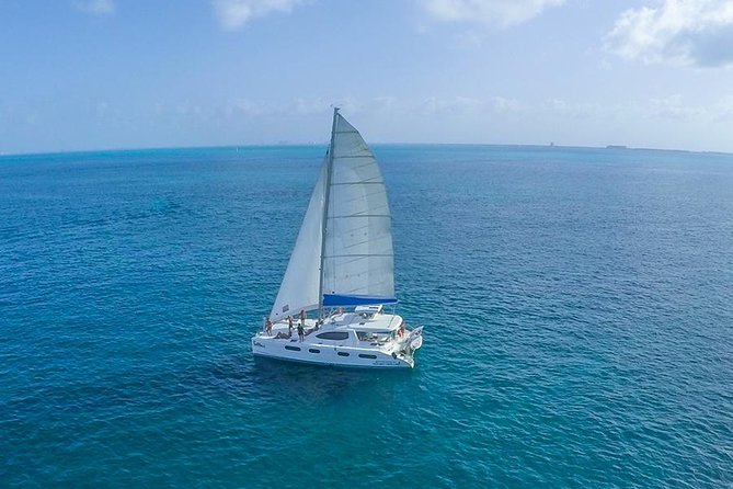 Snorkeling Adventure at Isla Mujeres Includes Lunch and Open Bar - The return sail and spinnaker activity