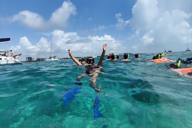 Top Isla Mujeres Catamaran Tour with Snorkel Open Bar and Buffet lunch - El Meco Reef and a short snorkel