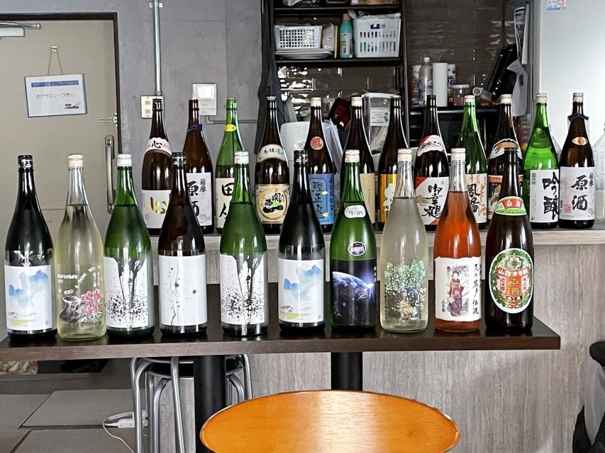Tsukiji: Unlimited Sake Tasting Experience - Cheese, rice crackers, and small bites