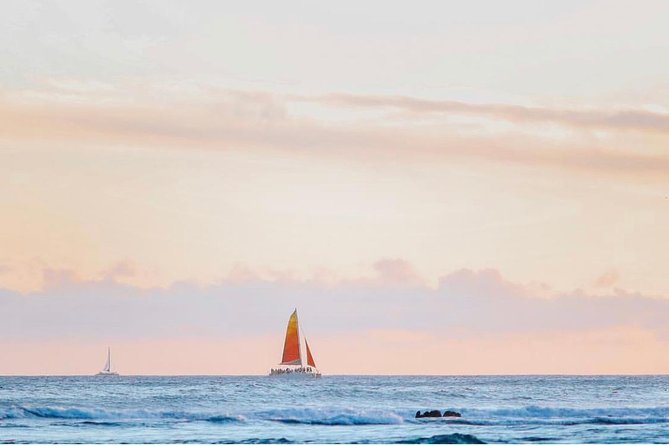 Waikiki Sunset Cocktail Sail with Open Bar - Boarding barefoot through sand and shallow water